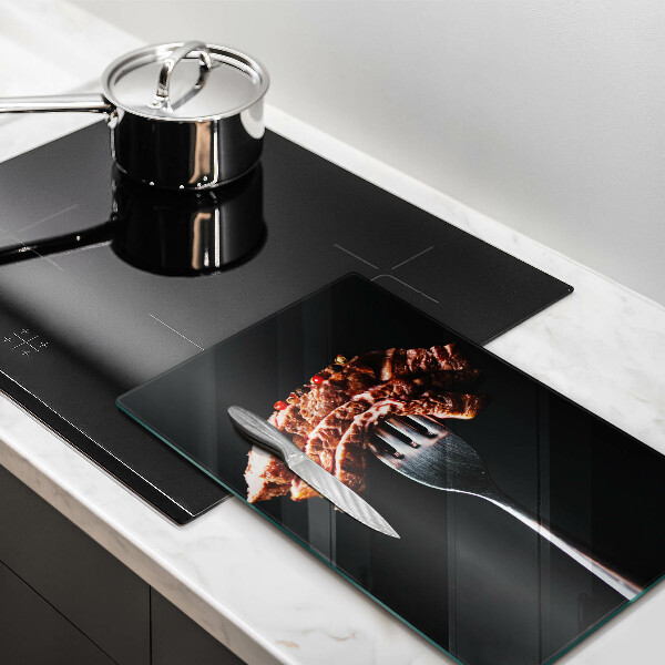 Glass worktop saver Meat on a fork