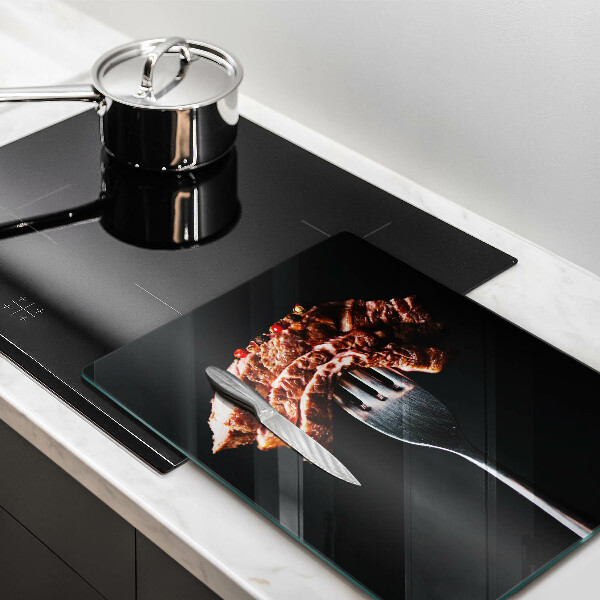 Glass worktop saver Meat on a fork