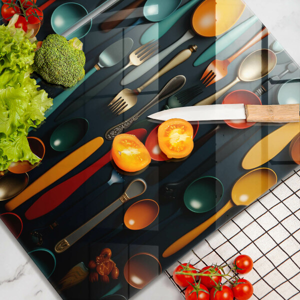 Chopping board Colorful spoons and forks