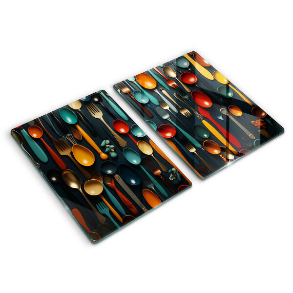 Chopping board Colorful spoons and forks