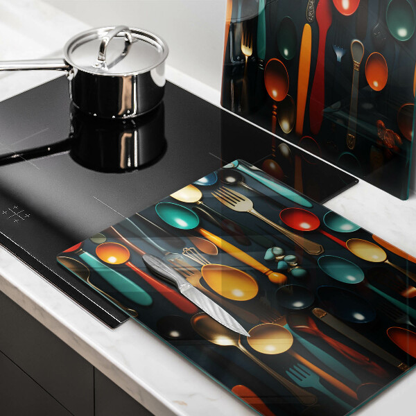 Chopping board Colorful spoons and forks