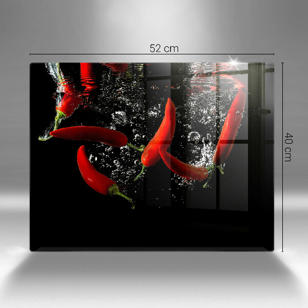 Chopping board glass Chili peppers in water