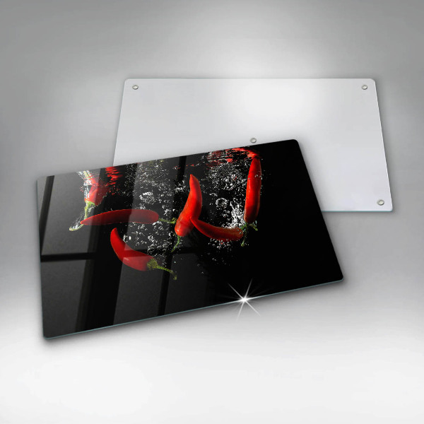 Chopping board glass Chili peppers in water