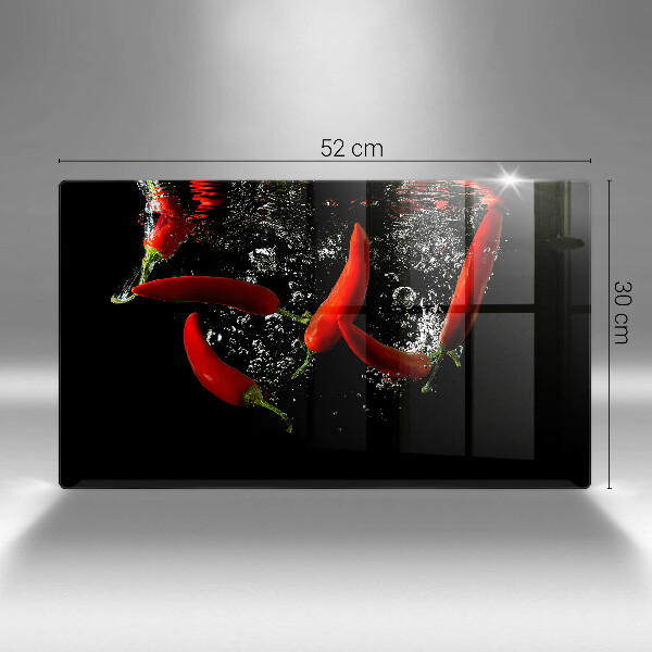 Chopping board glass Chili peppers in water