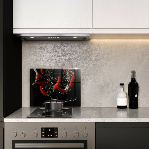 Chopping board glass Chili peppers in water