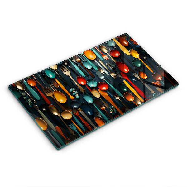 Chopping board Colorful spoons and forks