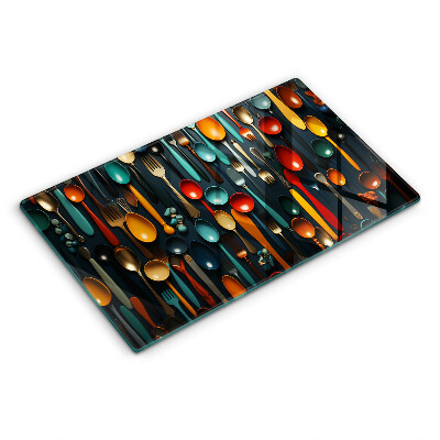 Chopping board Colorful spoons and forks