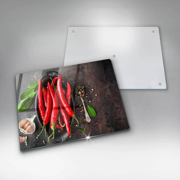 Chopping board glass Red chili peppers