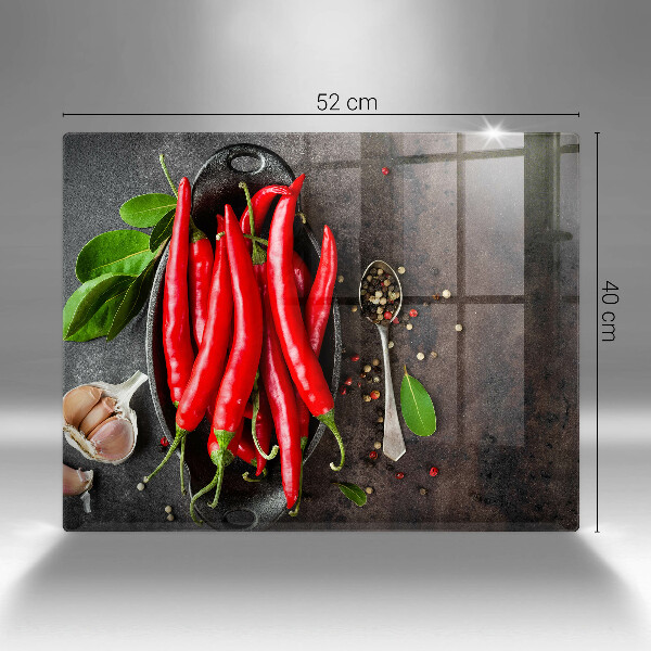 Chopping board glass Red chili peppers
