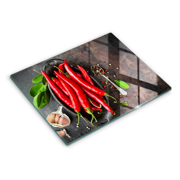 Chopping board glass Red chili peppers