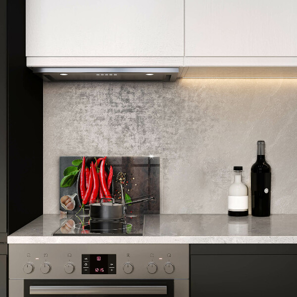 Chopping board glass Red chili peppers