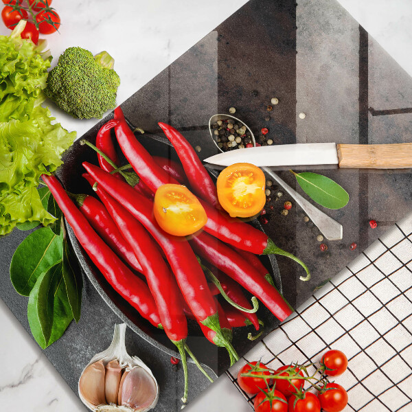 Chopping board glass Red chili peppers