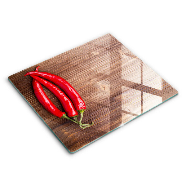 Chopping board Chili peppers on wood