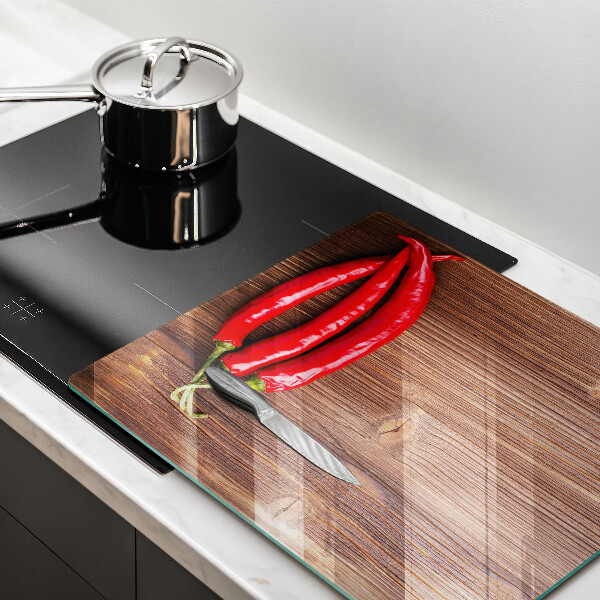 Chopping board Chili peppers on wood