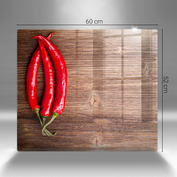 Chopping board Chili peppers on wood