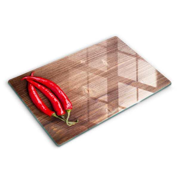 Glass cutting board Chili peppers on wood