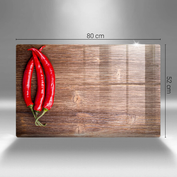 Glass cutting board Chili peppers on wood