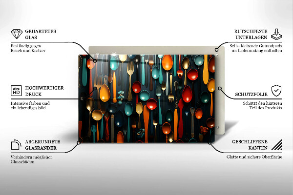 Chopping board glass Colorful spoons and forks