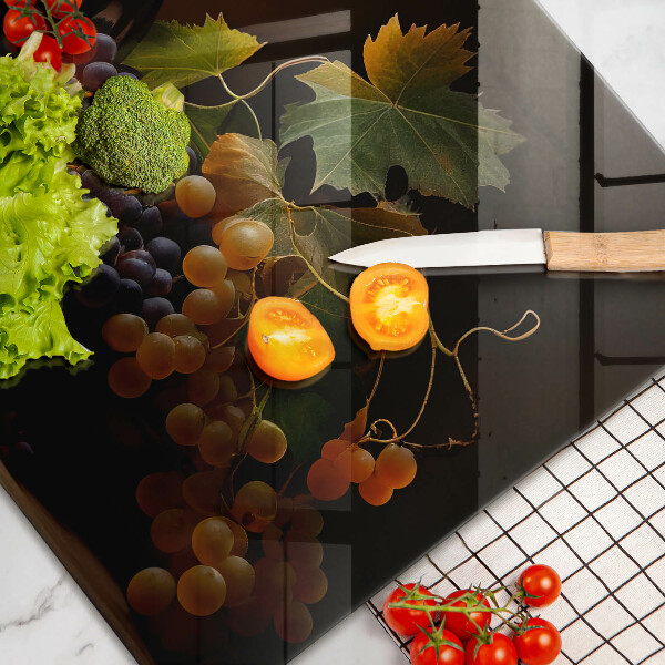 Chopping board glass A glass of wine and grapes