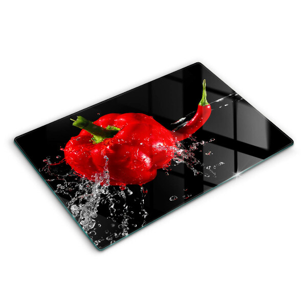 Chopping board glass Red peppers in water