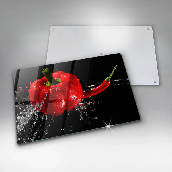 Chopping board glass Red peppers in water