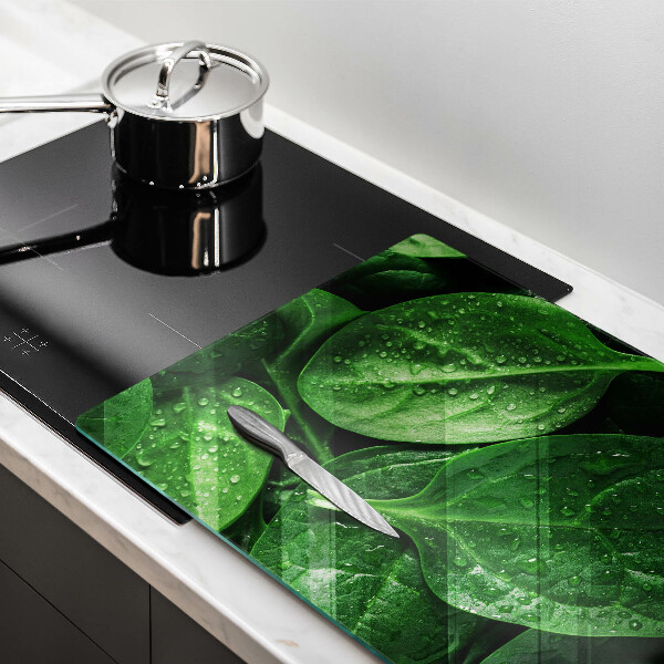 Chopping board glass Basil leaves