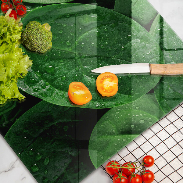 Chopping board glass Basil leaves
