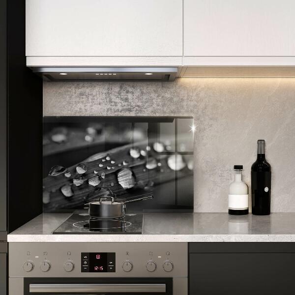 Chopping board glass Drops of dew on the leaves