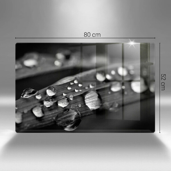 Chopping board glass Drops of dew on the leaves