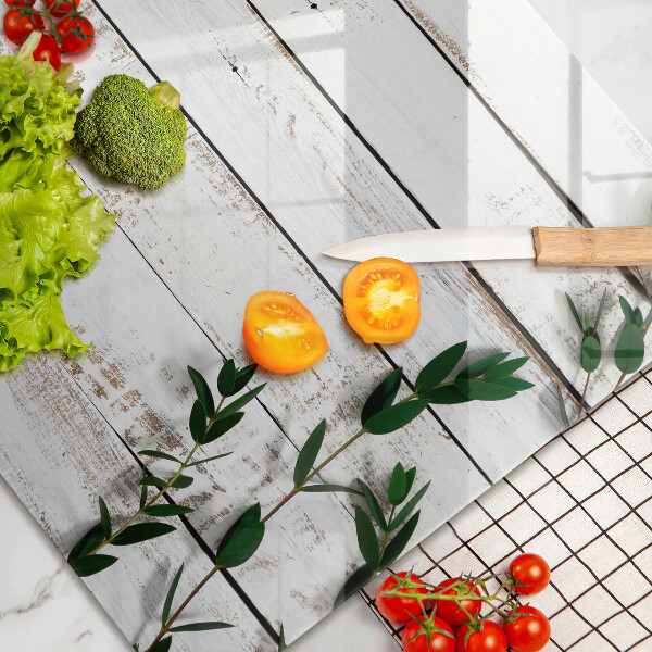 Glass kitchen board Old boards and leaves
