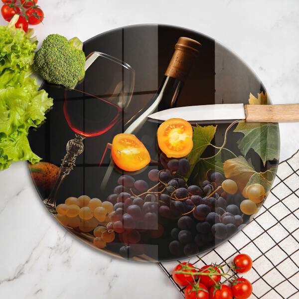 Chopping board glass A glass of wine and grapes