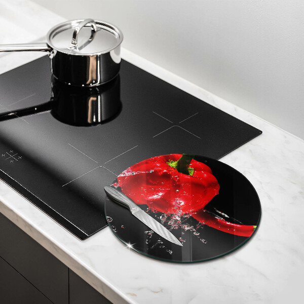 Glass worktop saver Red peppers in water