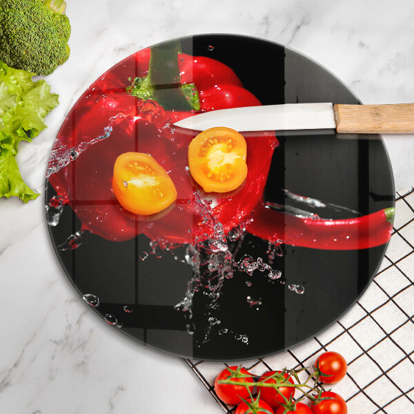 Glass worktop saver Red peppers in water