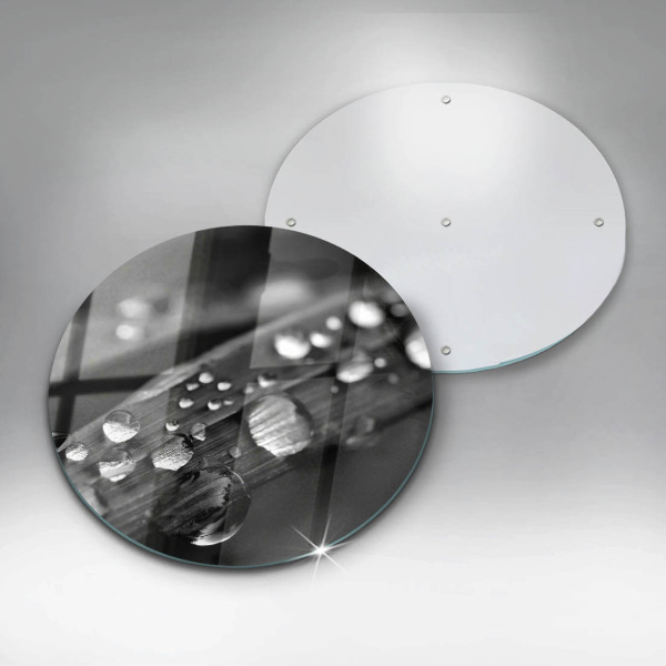 Chopping board glass Drops of dew on the leaves