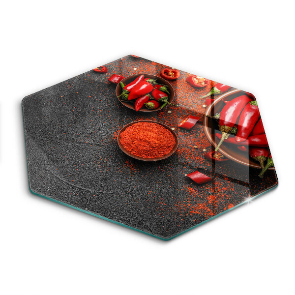 Chopping board glass Red chili peppers