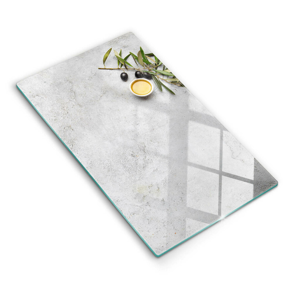 Glass worktop saver Olives on concrete