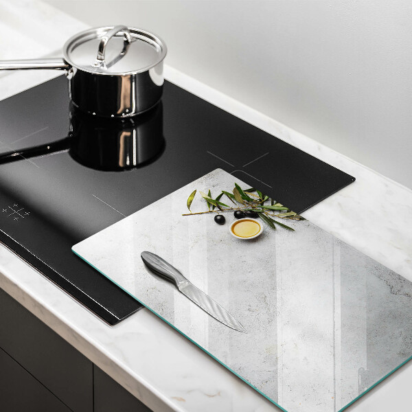 Glass worktop saver Olives on concrete