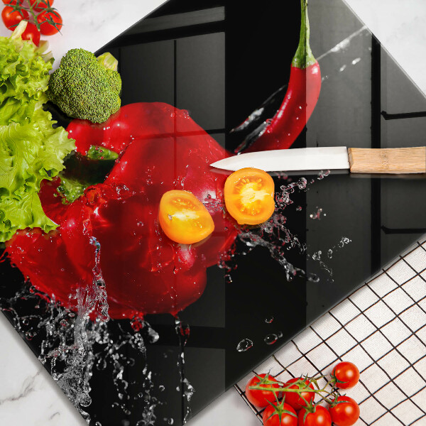 Induction hob protector Red peppers in water