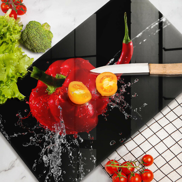 Induction hob protector Red peppers in water