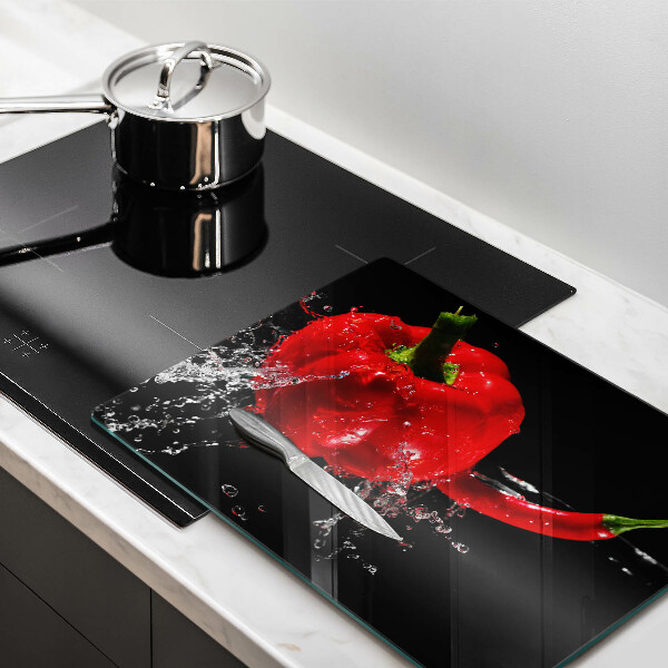 Induction hob protector Red peppers in water