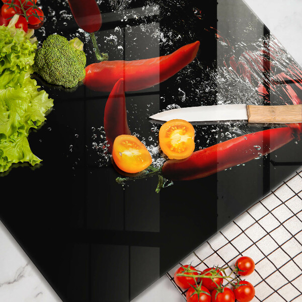 Work surface savers Chili peppers in water