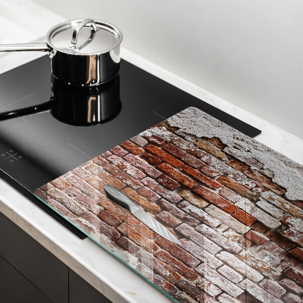 Induction hob cover Old wall of brick and concrete