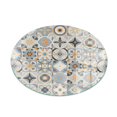 Round glass fire hearth Mosaic patterns in tiles