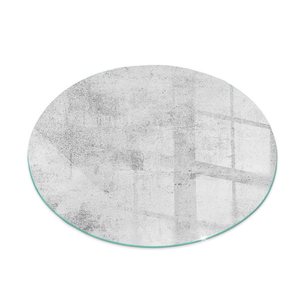Round glass wood burner hearth Raw concrete texture