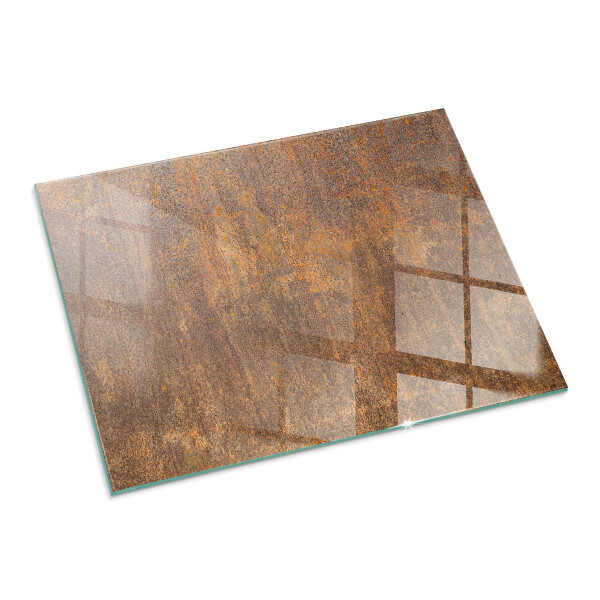 Rectangular glass hearth for log burner Rust texture on the background