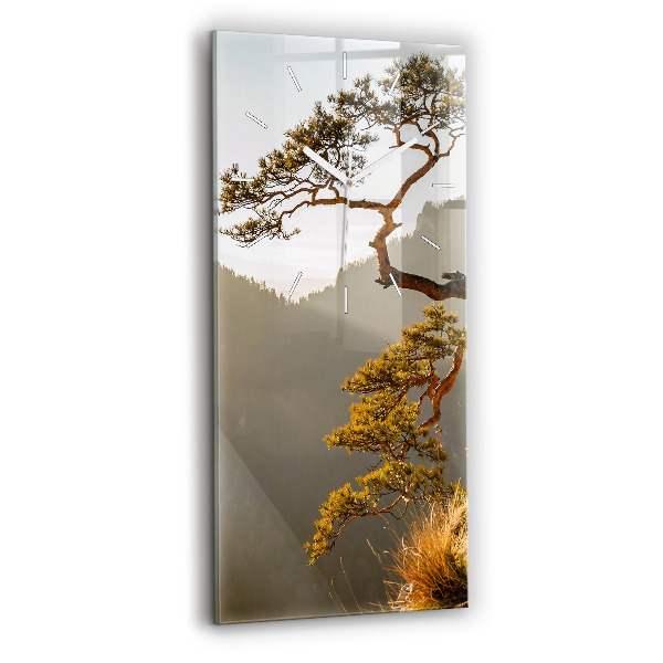 Modern vertical wall clock A tree in the mountains
