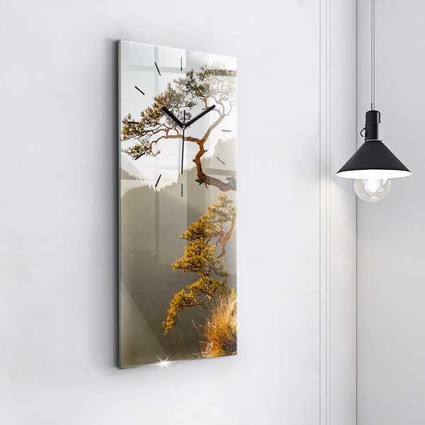 Modern vertical wall clock A tree in the mountains
