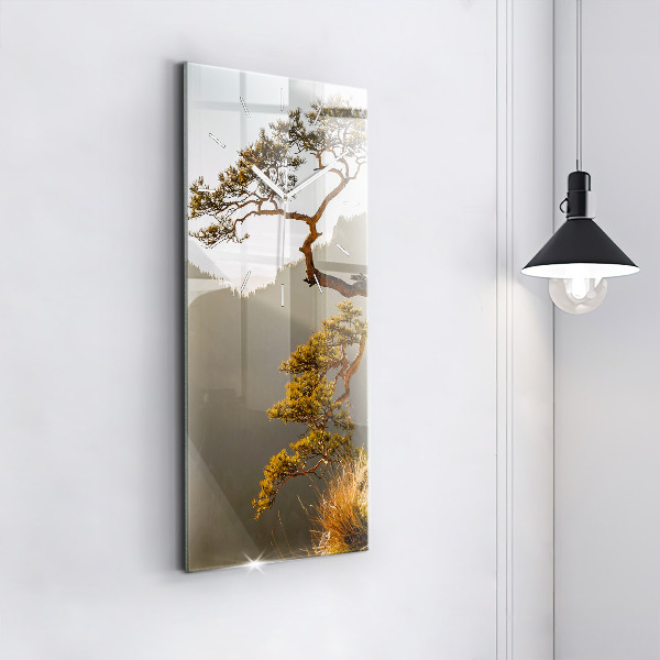 Modern vertical wall clock A tree in the mountains