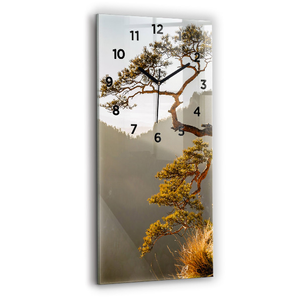 Modern vertical wall clock A tree in the mountains