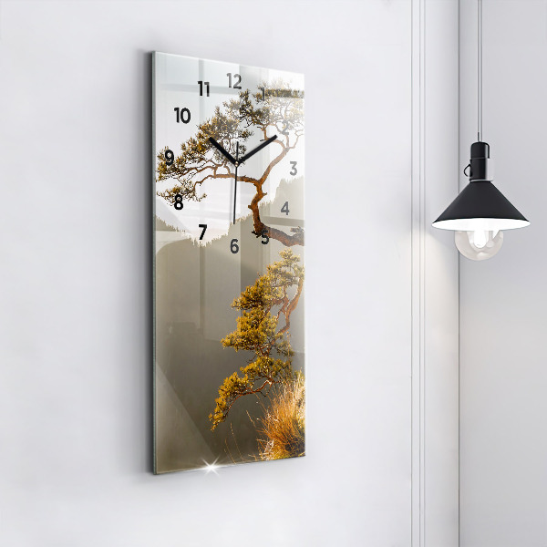 Modern vertical wall clock A tree in the mountains